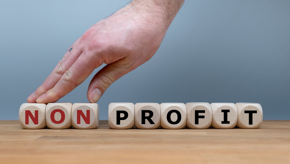 Hand changes the word "Nonprofit" to "Profit".